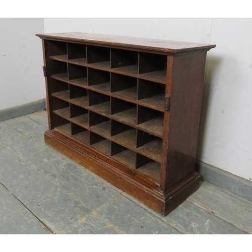 822 - A turn of the century mahogany bank of 25 shelves, with fielded back panels, on a plinth base.
H56cm... 