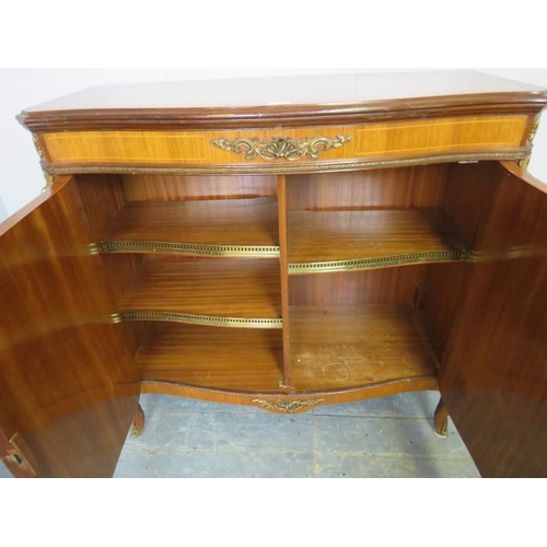 827 - A vintage French walnut and tulipwood serpentine fronted side cabinet in the 19th century taste, hav... 