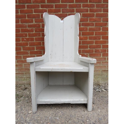 835 - An antique and later ‘lambing chair’ painted grey and distressed, the shaped wing back joined to an ... 