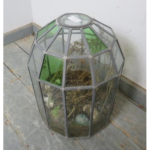 842 - A vintage domed terrarium, constructed of green and clear sectioned glass panels with leaded lights.... 