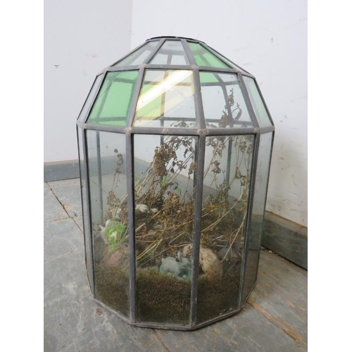 842 - A vintage domed terrarium, constructed of green and clear sectioned glass panels with leaded lights.... 