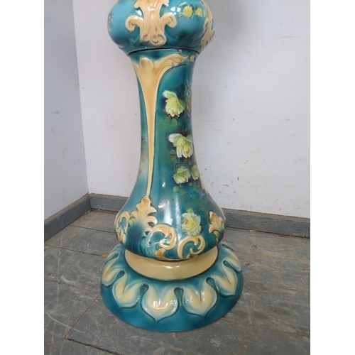 843 - A Victorian ceramic jardiniere on stand, with moulded acanthus leaf decoration, painted turquoise an... 