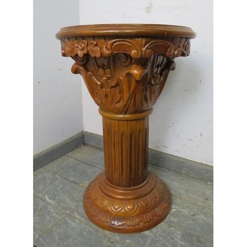 844 - A carved hardwood plantstand in the form of a Corinthian column with rouge marble insert. 
H61cm Dia... 