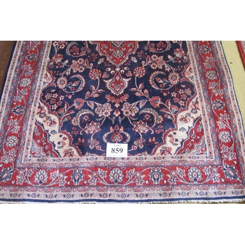 859 - North West Persian Sarouk rug.  Similar to Kashan with central medallion, red on blue and foliage su... 