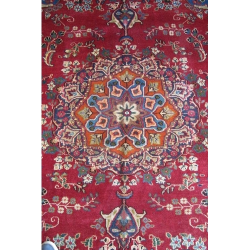 862 - North East Persian Meshed carpet.  A large patterned medallion to the center, surrounded by floral d... 