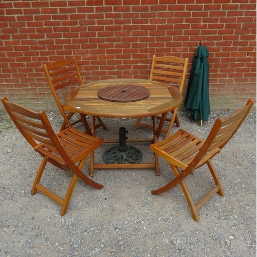 850 - A teak garden set, comprising a circular folding table and four folding garden chairs, together with... 