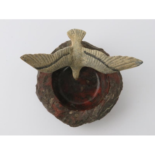 1 - A vintage red serpentine marble pin dish mounted with a cold painted metal swooping seagull, early/m... 