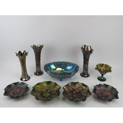 10 - A group of carnival glass wares. Comprising a pair of vases, two pairs of bowls, a large bowl, a com... 