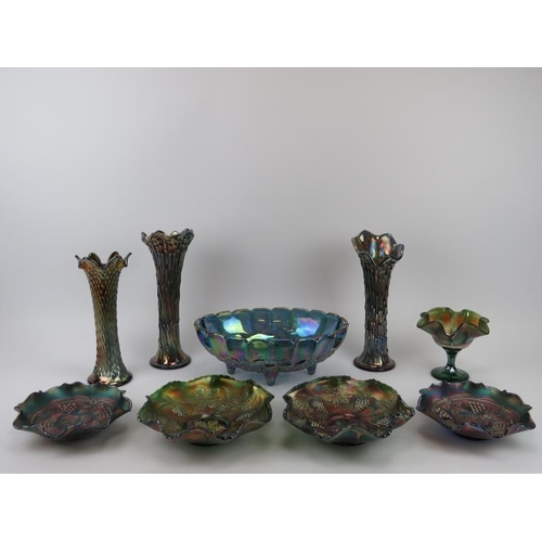 10 - A group of carnival glass wares. Comprising a pair of vases, two pairs of bowls, a large bowl, a com... 