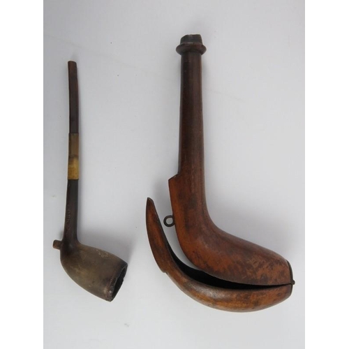 107 - Tobacconalia: A group of antique pipes and related articles. Notable items include a pipe bowl model... 