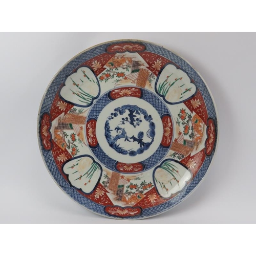 111 - A large Japanese Imari porcelain charger, Meiji period (1868 - 1912). Marks to reverse. 48 cm diamet... 