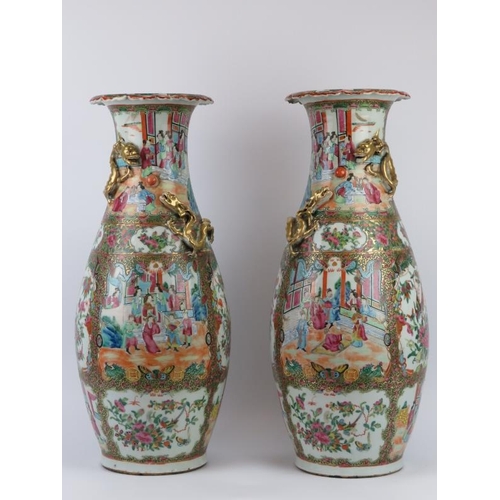 22 - A large pair of Chinese famille rose medallion enamelled porcelain vases, Canton, mid 19th century. ... 