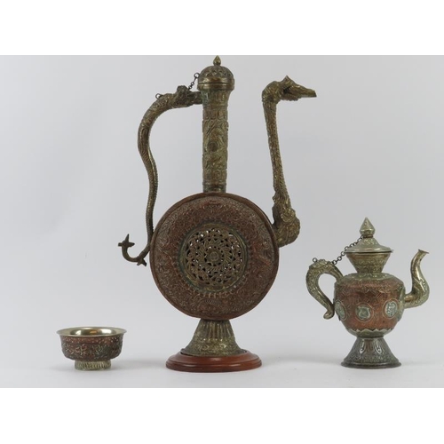 32 - A large copper and white metal ewer, teapot and sugar bowl, Nepal/Tibet, 20th century. The ewer of M... 