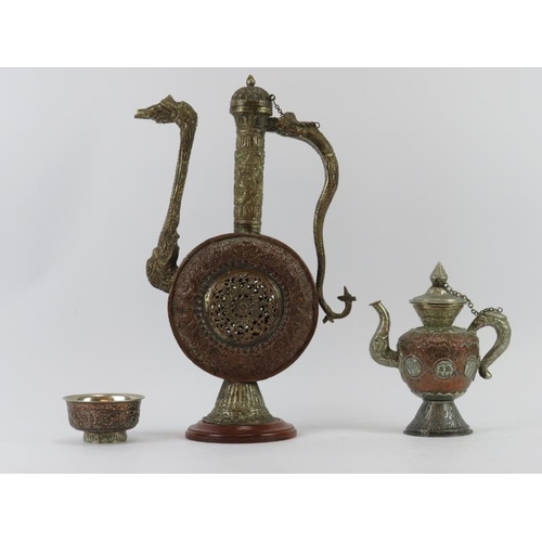 32 - A large copper and white metal ewer, teapot and sugar bowl, Nepal/Tibet, 20th century. The ewer of M... 