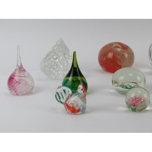 33 - A collection of vintage glass paperweights. Comprising seventeen glass paperweights and a resin pape... 