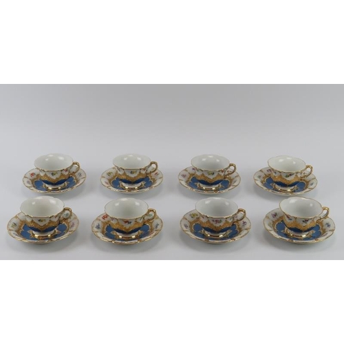 34 - Eight Meissen porcelain tea cups and saucers, 20th century. Gilt blue and white porcelain hand paint... 