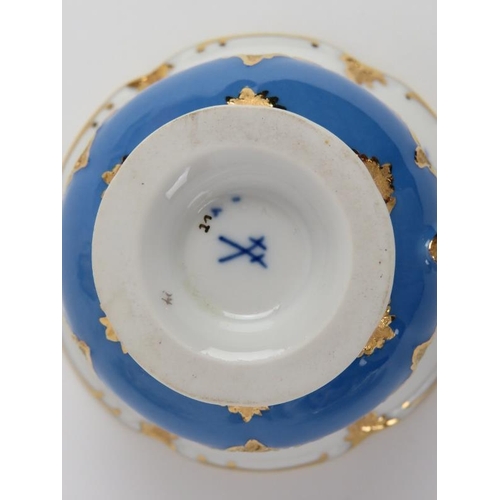 34 - Eight Meissen porcelain tea cups and saucers, 20th century. Gilt blue and white porcelain hand paint... 