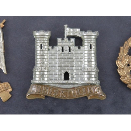 42 - Militaria: A group of British military cap badges, circa WWI & WWII. Notable badges include a Britis... 