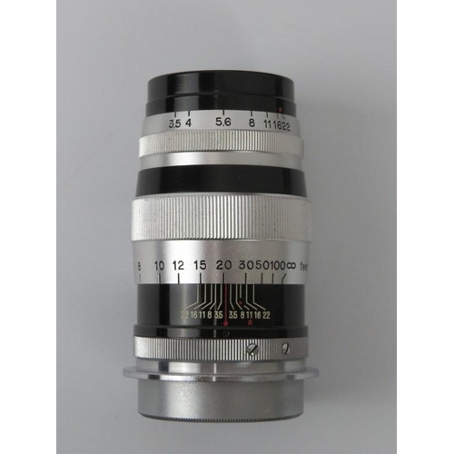 52 - A Canon 100mm f:3.5 lens with Series VI Serenar f:3.5 50mm/34mm.
Condition report: Light age related... 