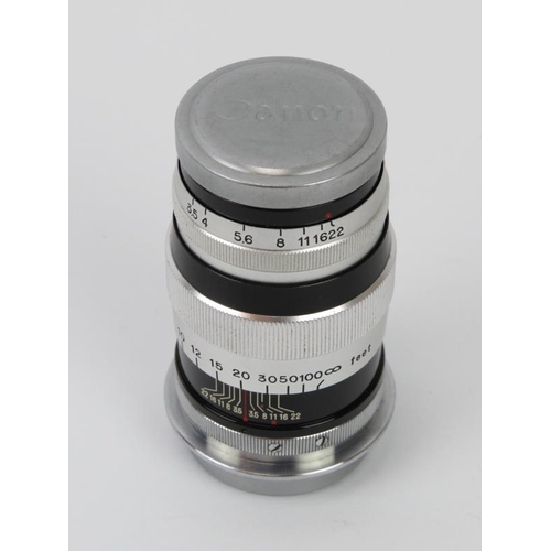 52 - A Canon 100mm f:3.5 lens with Series VI Serenar f:3.5 50mm/34mm.
Condition report: Light age related... 