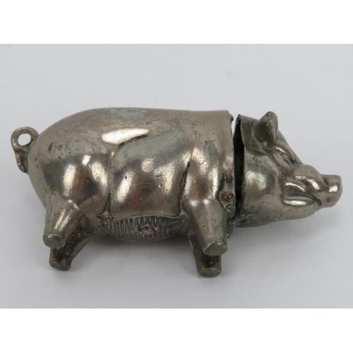 60 - A vintage novelty metal pig vesta and outdoor lavatory vesta with enclosed seated male. (2 items) 3.... 