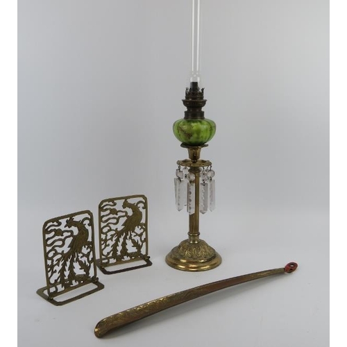 66 - A gilt metal oil lamp with green glass reservoir and lustres, a gilt brass shoe horn and two Thai fo... 