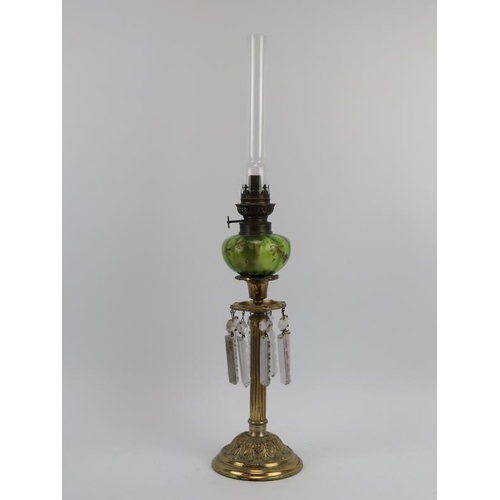 66 - A gilt metal oil lamp with green glass reservoir and lustres, a gilt brass shoe horn and two Thai fo... 