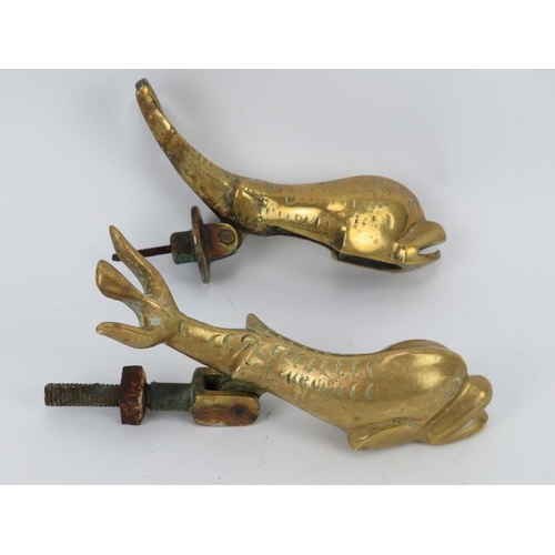 67 - Two brass dolphin door knockers, probably late 19th/early 20th century. (2 items) cm length. 
Condit... 