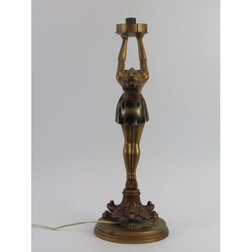 81 - An Art Deco semi nude dancing female table lamp, early 20th century. cm height.
Condition report: So... 