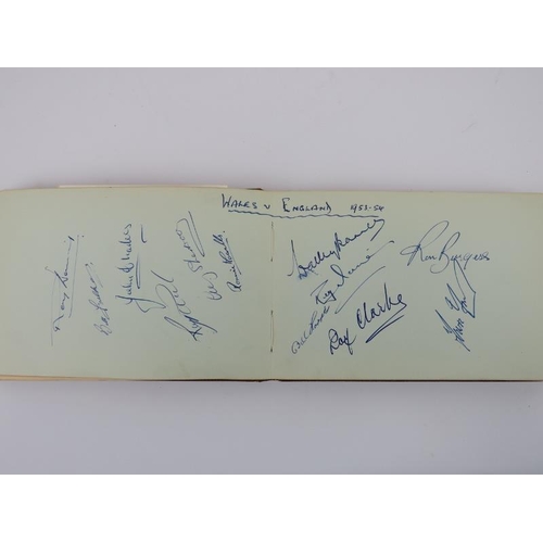 86 - Sporting memorabilia: An autograph album containing signatures of British football players and celeb... 