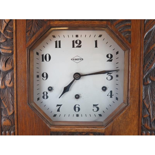 91 - A French Vedette carved oak Westminster chiming wall clock, early 20th century. 80.5 cm height, 33.8... 