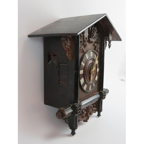 92 - A Swiss Black Forest style cuckoo wall clock, early 20th century. 35.5 cm height. 
Condition report:... 