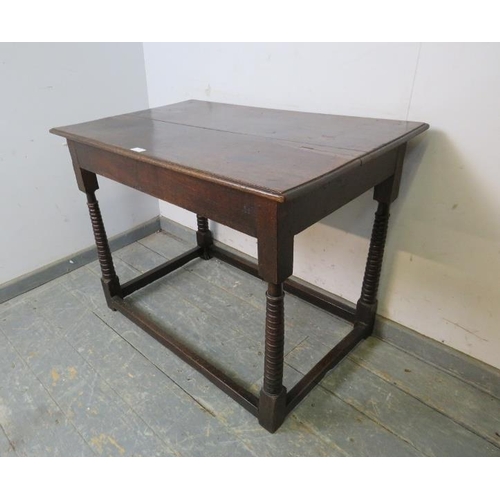 705 - A 17th century oak side table of good colour, the planked top above a plain frieze, on unusual taper... 