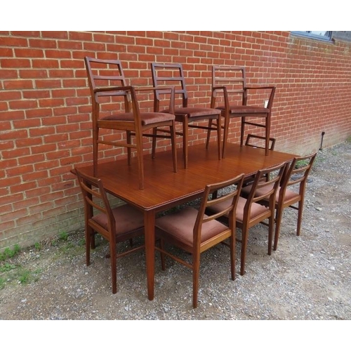 711 - A mid-century Afromosia teak draw-leaf extending dining table by Richard Hornby for Heal’s, with add... 