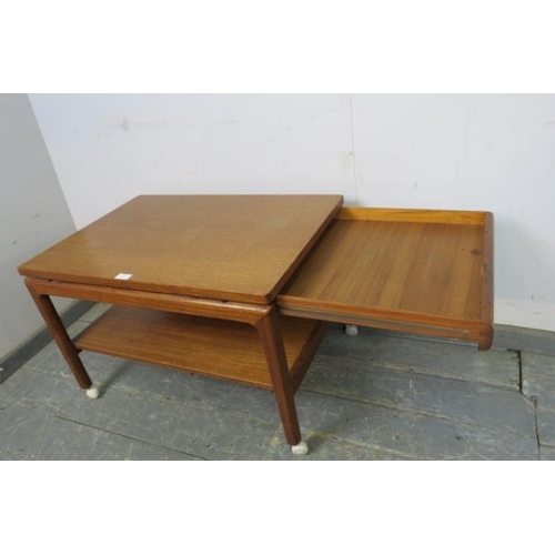 713 - A mid-century Danish solid teak two-tier coffee table by France & son, having blind frieze drawer to... 