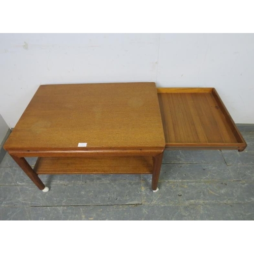 713 - A mid-century Danish solid teak two-tier coffee table by France & son, having blind frieze drawer to... 