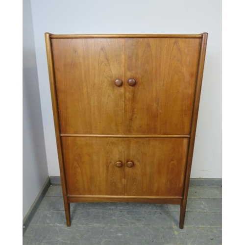 714 - A mid-century teak drinks cabinet by Younger, the double doors opening to reveal a fitted interior w... 