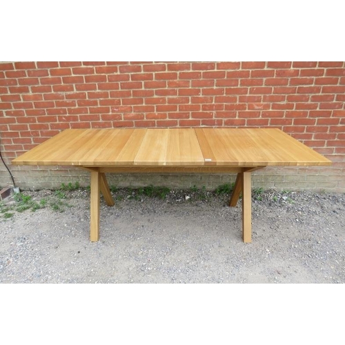 715 - A contemporary light oak draw-leaf extending dining table, with additional leaf, by Bethan Gray, on ... 