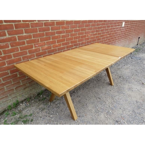 715 - A contemporary light oak draw-leaf extending dining table, with additional leaf, by Bethan Gray, on ... 