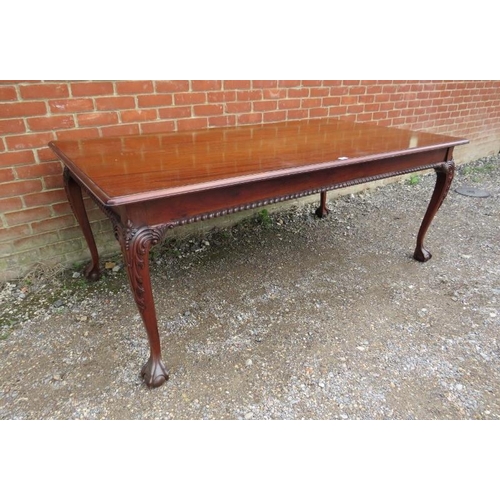 720 - A rectangular mahogany dining table in the Chippendale taste, the top above a plain frieze with gadr... 