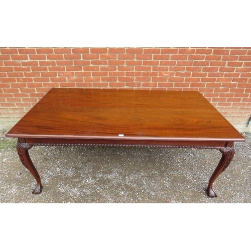 720 - A rectangular mahogany dining table in the Chippendale taste, the top above a plain frieze with gadr... 