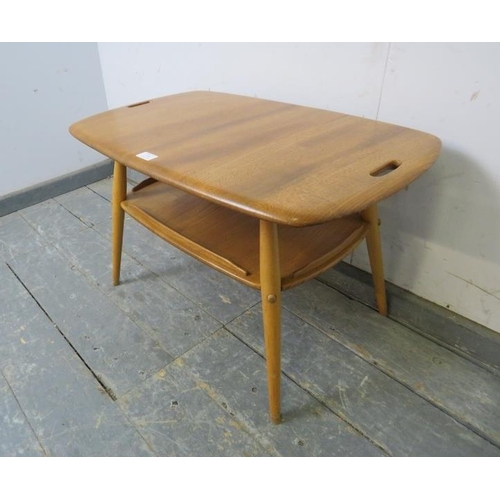 726 - A mid-century blonde elm and beech two-tier Windsor butler’s tray table by Ercol, on canted supports... 