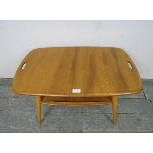 726 - A mid-century blonde elm and beech two-tier Windsor butler’s tray table by Ercol, on canted supports... 