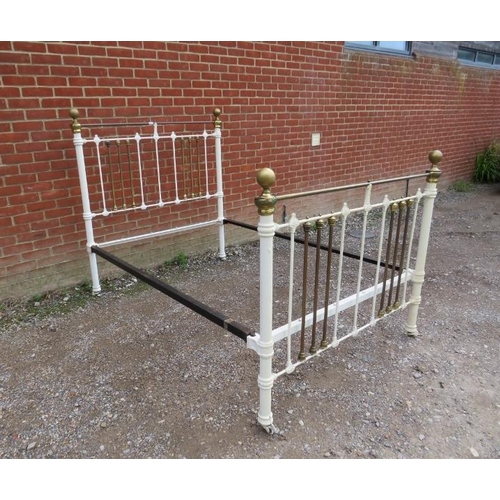 735 - An antique brass double bed painted white, with brass ball finials. 
H149cm W140cm D200cm (approx).
... 