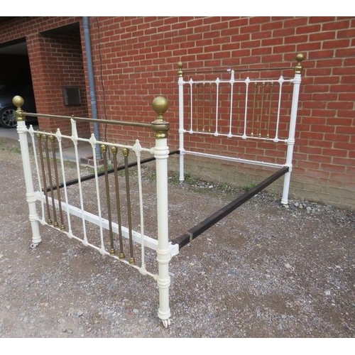 735 - An antique brass double bed painted white, with brass ball finials. 
H149cm W140cm D200cm (approx).
... 