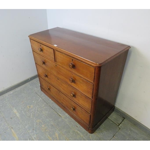 740 - A Victorian mahogany chest housing two short and three long graduated cock-beaded drawers with the o... 