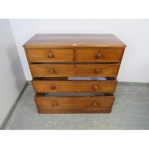 740 - A Victorian mahogany chest housing two short and three long graduated cock-beaded drawers with the o... 