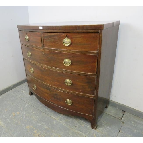 741 - A George III mahogany bow front chest housing two short and three long graduated cock-beaded drawers... 