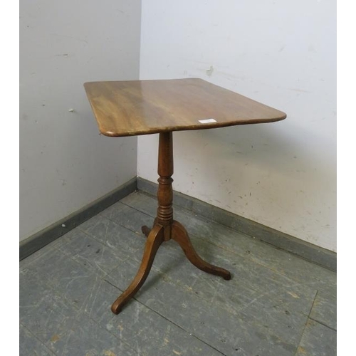 744 - A 19th century pale mahogany tilt-top wine table, on a baluster turned pedestal with splayed tripod ... 