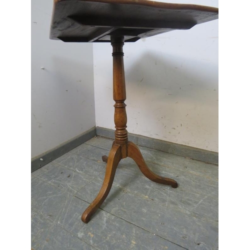 744 - A 19th century pale mahogany tilt-top wine table, on a baluster turned pedestal with splayed tripod ... 